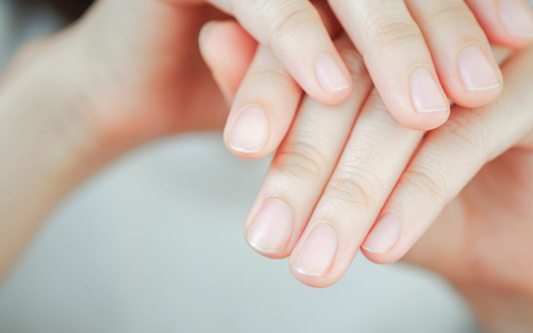Close-up of woman's fingernail. Hand concept.