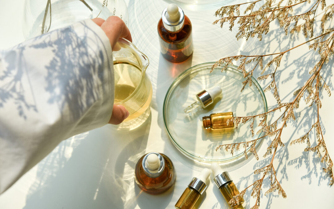 Scientist mixing natural skin care beauty products, Organic oil botany extraction and scientific laboratory glassware