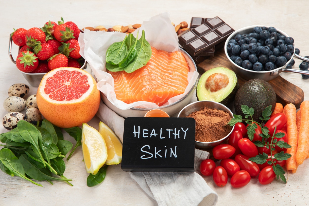 Food for healthy skin. Assortment of various natural food products high in vitamins and minerals for skin health. Nutrition for beautiful supple skin. Top view.